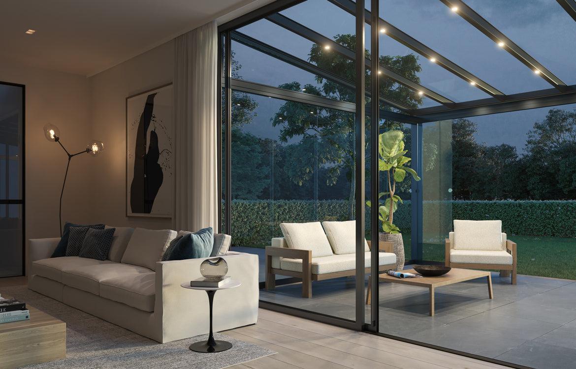 Modern veranda with glass roof and integrated LED lights, connecting to a stylish living room.